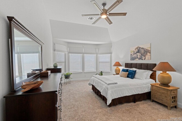 carpeted bedroom with lofted ceiling and ceiling fan