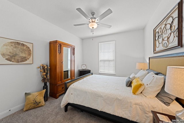 bedroom with ceiling fan and carpet