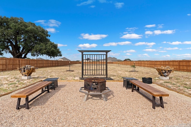 view of yard with an outdoor fire pit