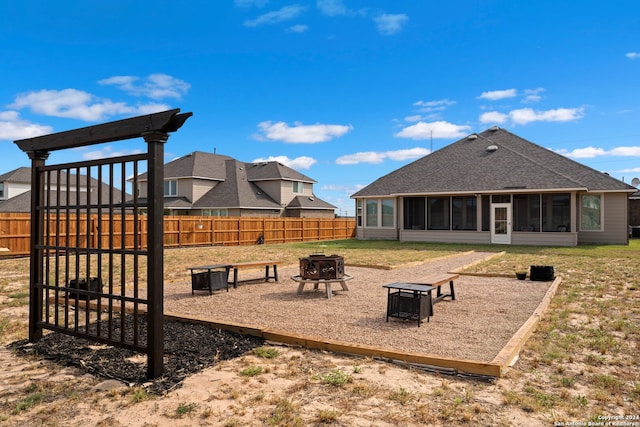 view of community with an outdoor fire pit