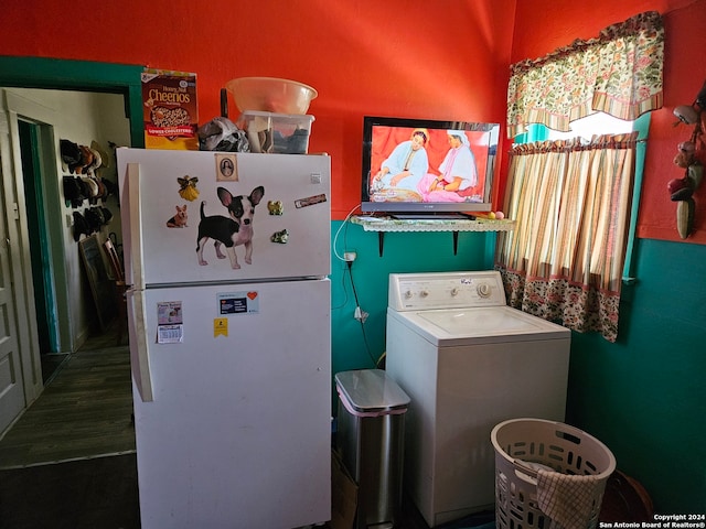 laundry area featuring washer / dryer and dark hardwood / wood-style floors