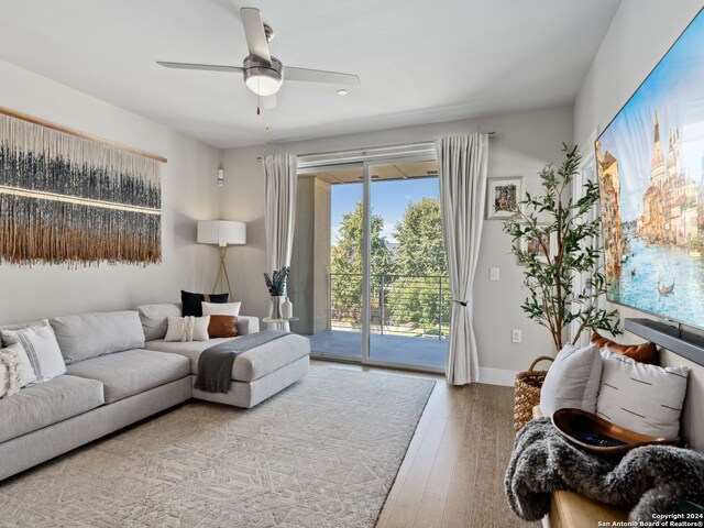 dining area with ceiling fan and light hardwood / wood-style floors