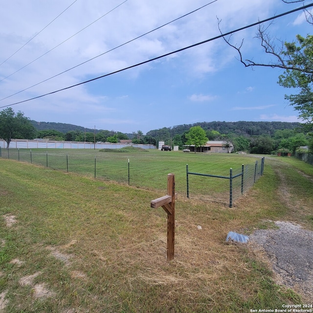 exterior space featuring a yard and a rural view