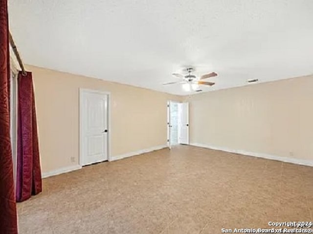 empty room with ceiling fan