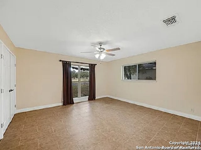 interior space featuring ceiling fan