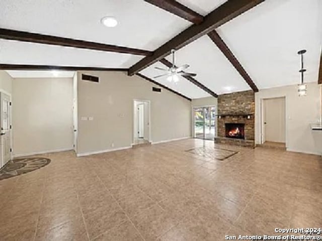 unfurnished living room with vaulted ceiling with beams, ceiling fan, and a fireplace