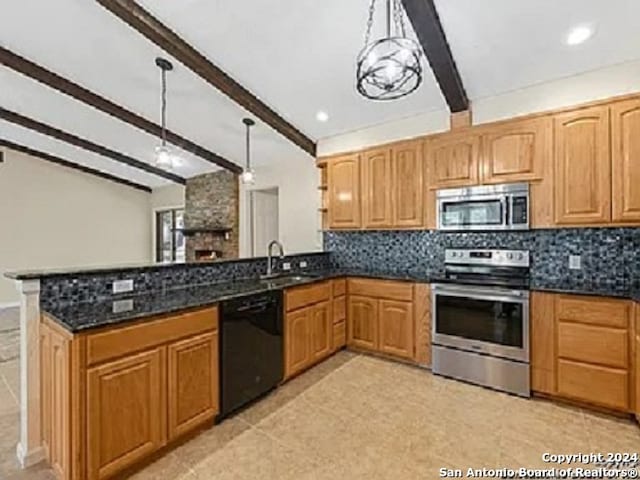 kitchen featuring pendant lighting, sink, beam ceiling, backsplash, and appliances with stainless steel finishes