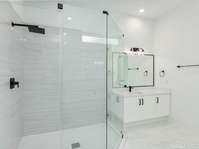 bathroom featuring vanity and a shower with door