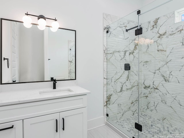 bathroom with vanity and an enclosed shower