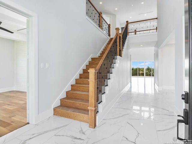 stairs featuring hardwood / wood-style flooring