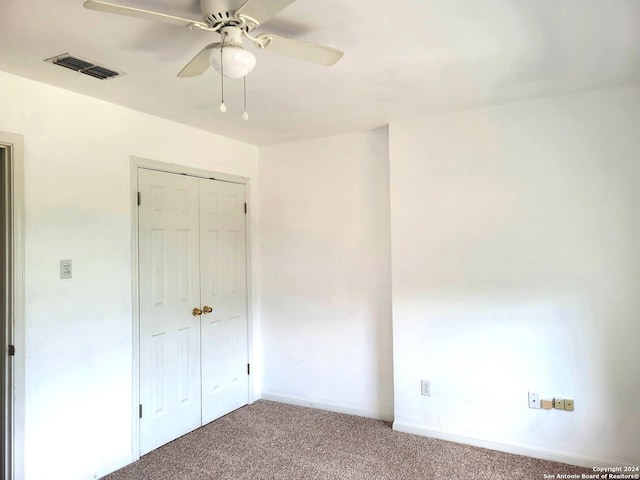 empty room with carpet flooring and a healthy amount of sunlight