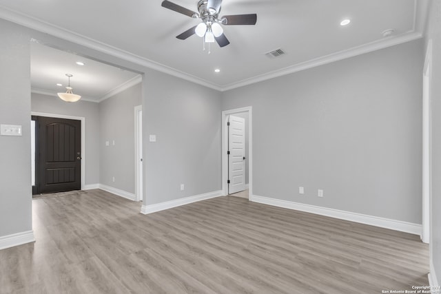 unfurnished room featuring crown molding, ceiling fan, and light hardwood / wood-style floors