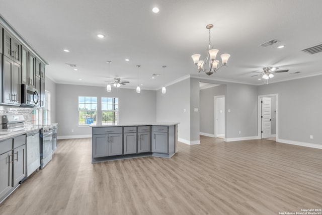 kitchen featuring appliances with stainless steel finishes, ceiling fan with notable chandelier, light wood-type flooring, and ornamental molding