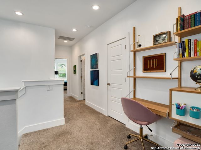 home office with light carpet