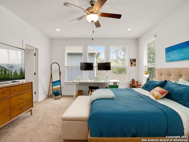 carpeted bedroom with ceiling fan