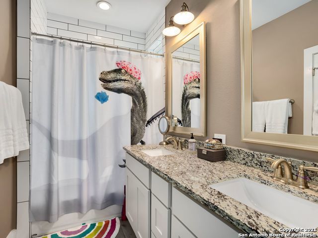 bathroom featuring vanity and a shower with curtain