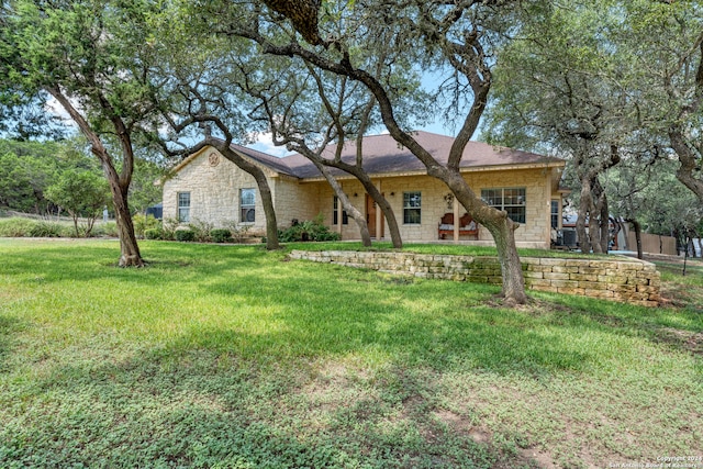 ranch-style home with a front yard