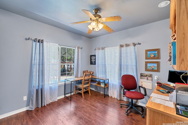 office space featuring dark wood-type flooring and ceiling fan