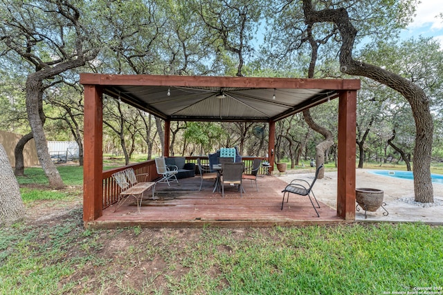 surrounding community featuring a swimming pool side deck and a gazebo