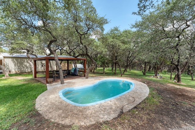 view of swimming pool with a yard, a patio area, and a gazebo