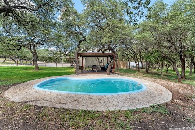 view of swimming pool featuring a yard, a patio, and a gazebo