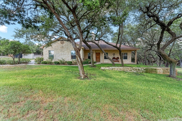 ranch-style home with a front yard