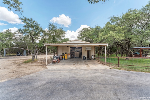 exterior space with a lawn and a carport