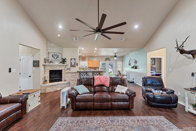 living room with a fireplace, high vaulted ceiling, ceiling fan, and dark hardwood / wood-style floors