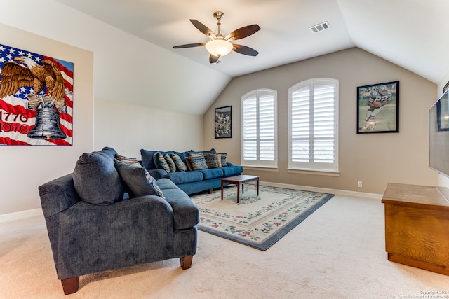 living room featuring ceiling fan, carpet floors, and vaulted ceiling