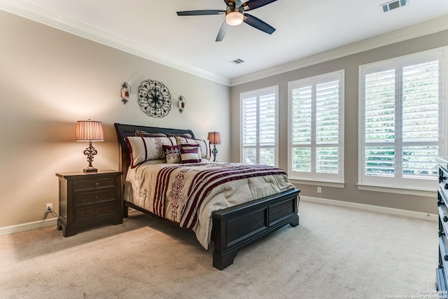 bedroom featuring carpet floors, visible vents, crown molding, and baseboards