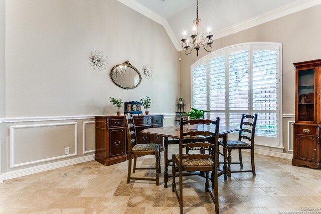 dining area featuring ornamental molding, high vaulted ceiling, and an inviting chandelier