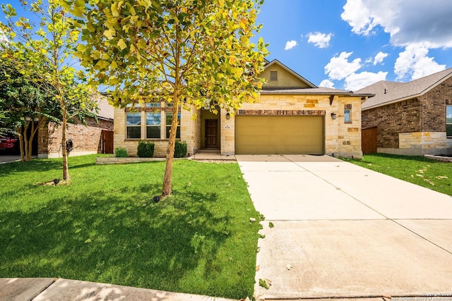 view of front of house featuring a garage, a front yard, driveway, and stone siding