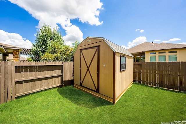 view of shed featuring a fenced backyard
