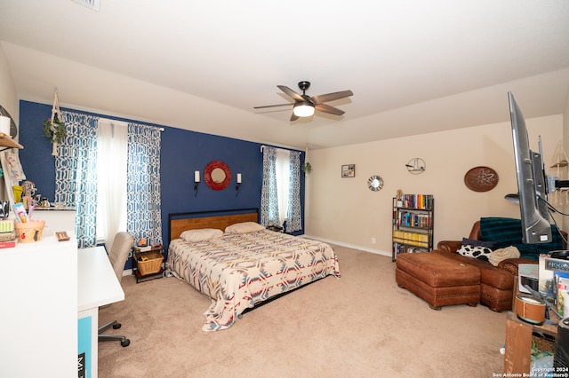 bedroom featuring ceiling fan and light carpet