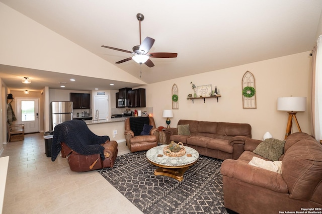 living room with vaulted ceiling, a ceiling fan, and recessed lighting