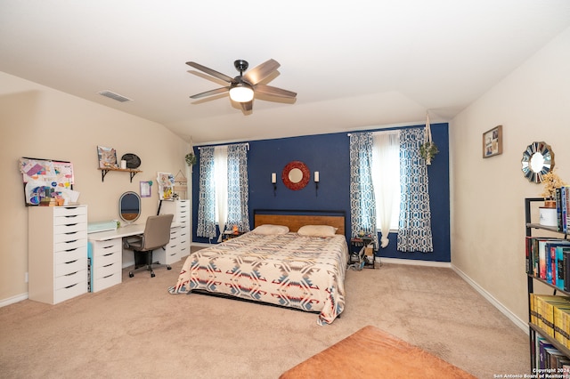 carpeted bedroom featuring lofted ceiling and ceiling fan