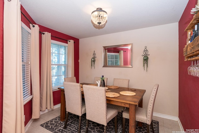 dining area with light tile patterned floors and baseboards