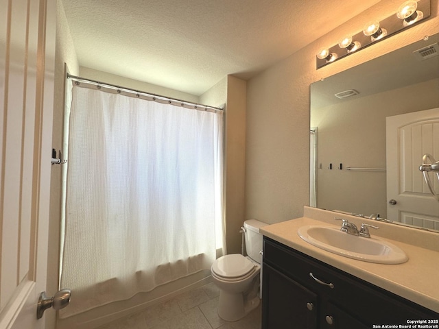 bathroom featuring visible vents, toilet, a textured ceiling, vanity, and tile patterned flooring