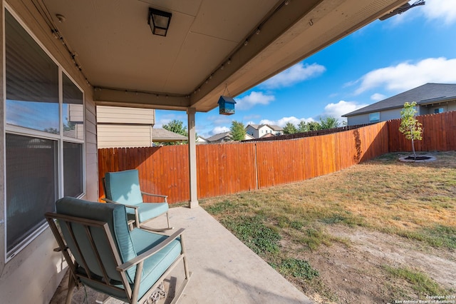 view of yard featuring a patio and a fenced backyard