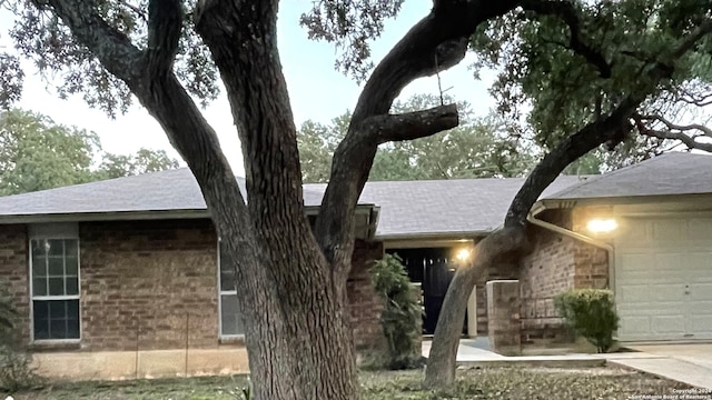 ranch-style home featuring a garage