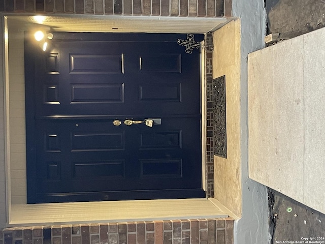 view of exterior entry featuring a garage