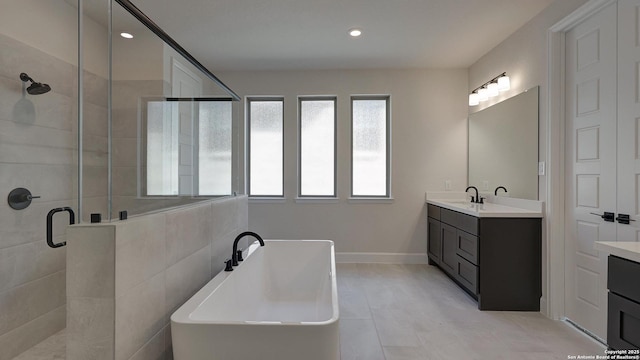 bathroom featuring vanity and plus walk in shower