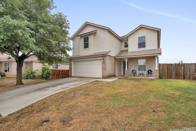 view of front property with a front yard and a garage