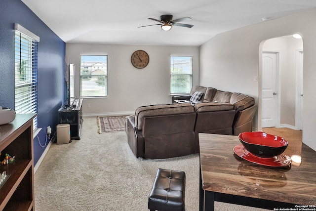 living room with ceiling fan, carpet floors, plenty of natural light, and vaulted ceiling