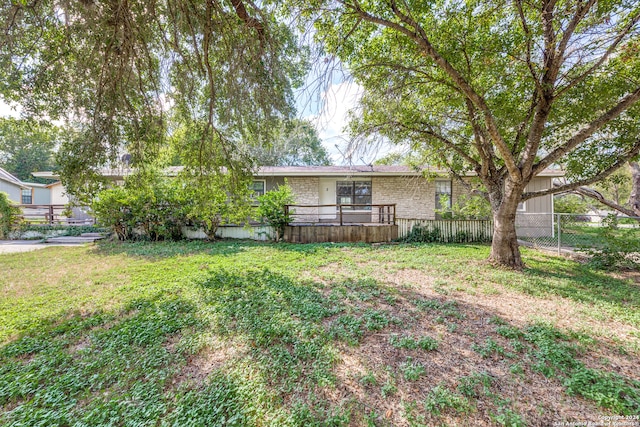 view of yard featuring a wooden deck