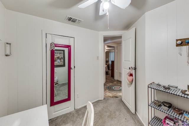 interior space featuring light colored carpet