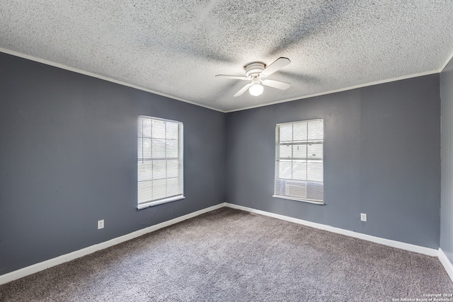 spare room featuring a textured ceiling, carpet flooring, and ceiling fan