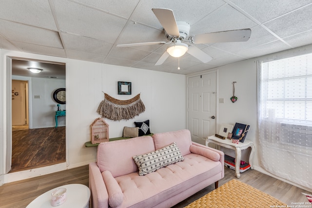 bedroom with a paneled ceiling, ceiling fan, and wood-type flooring