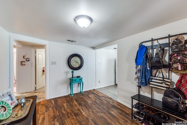 entrance foyer with a textured ceiling and hardwood / wood-style flooring