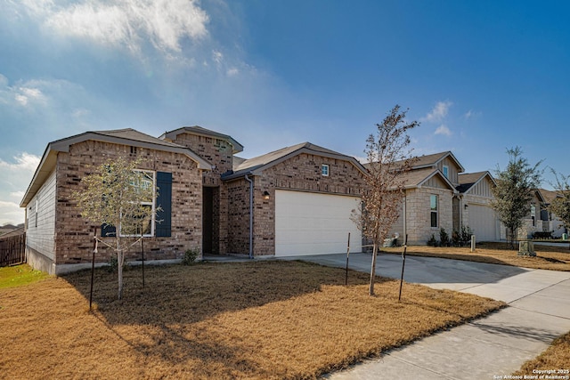 ranch-style house featuring an attached garage, brick siding, driveway, and a front lawn